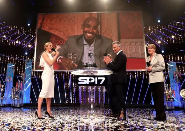 Host Gabby Logan introduces the 2017 Sports Personality of the Year winner Sir Mo Farah during last years show in Liverpool. Picture: David Davies/PA