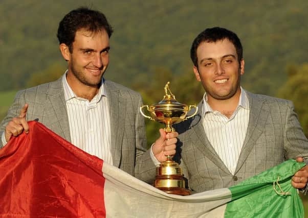 Edoardo, left, and Francesco Molinari pose with the Ryder Cup after helping Colin Montgomeries European team beat the US at Celtic Manor in 2010. Picture: AFP/Getty.
