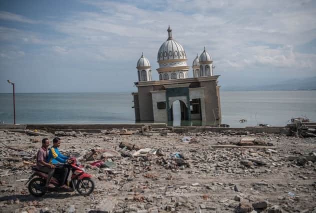 The Earthquake and tsunami in Indonesia has killed over 1,500. (Photo by Carl Court/Getty Images)