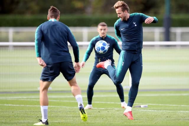 Tottenham forward Harry Kane flicks the ball up during a training session ahead of tonights Champions League clash with Barcelona at Wembley. Picture: PA.