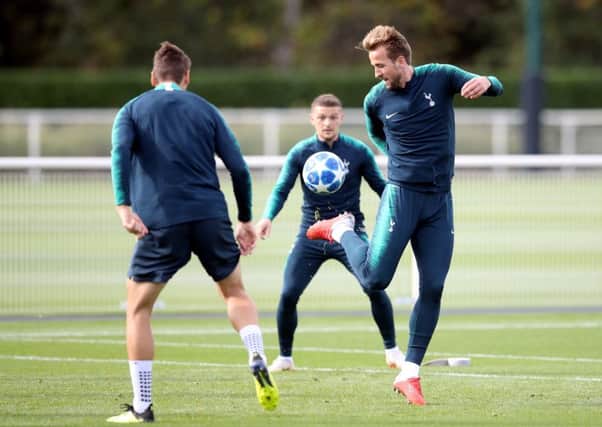 Tottenham forward Harry Kane flicks the ball up during a training session ahead of tonights Champions League clash with Barcelona at Wembley. Picture: PA.