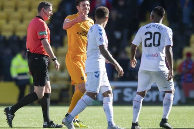 Livingston defender Declan Gallagher exchanges words with Alfredo Morelos after the full-time whistle. Picture: SNS