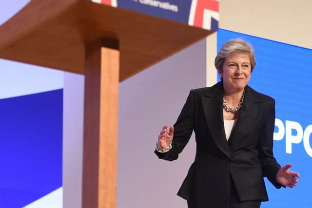 Theresa May dances a few steps as she takes the stage to give her keynote address on the fourth and final day of the Conservative Party Conference 2018. Picture: Oli SCARFF / AFP)OLI SCARFF/AFP/Getty Images.