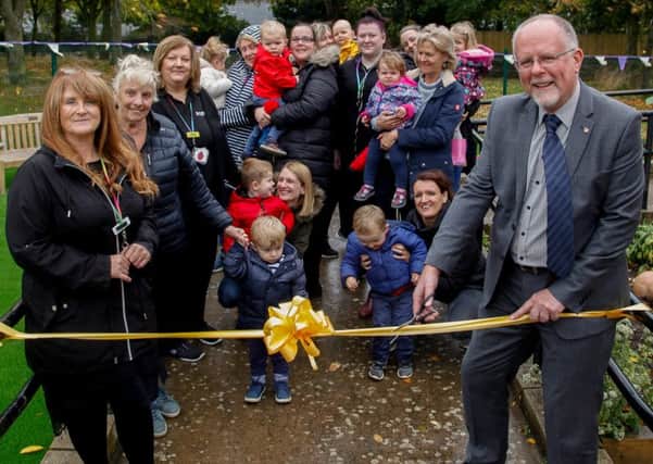 Bright Sparks Playgroup, Bonnyrigg. Official Play area opening. 08/10/18 Cllr Jim Muirhead cuts the ribbon