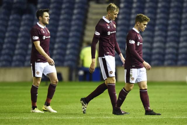 Hearts players, including current stand-in captain John Souttar (left), walk off following defeat to Kilmarnock - the club's last fixture at Murrayfield. Picture: SNS