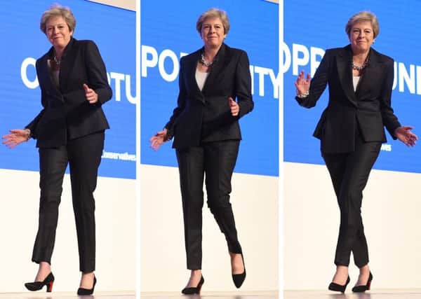 Theresa May dances onto the stage at the Conservative party conference to the tune of Abba's Dancing Queen (Picture: Oli Scarff/AFP/Getty Images)
