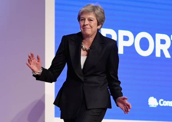Theresa May dances onto the stage ahead of her Conservative party speech (Picture: Jeff J Mitchell/Getty Images)