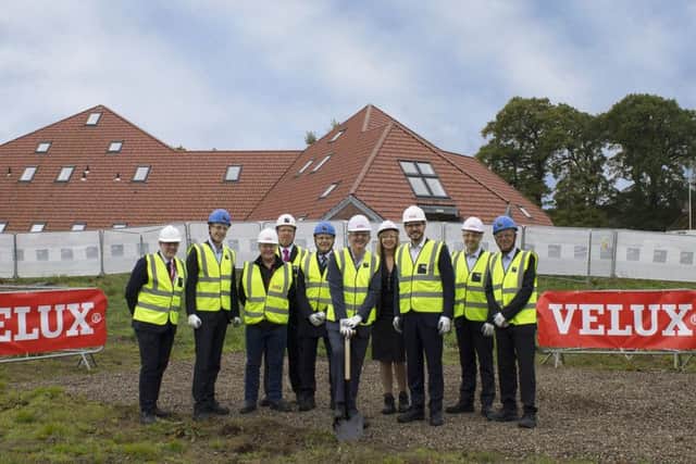 Councillor Altany Craik (left) with the Velux team before work begins on the office expansion. Picture: Velux