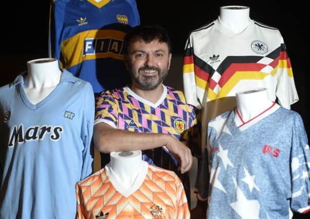 Collector and football shirt lover Neal Heard, 49, showcasing some of the shirts in his vast collection as part of his exhibition Art of The Football Shirt, which opens at the Arches, Glasgow this weekend. Picture: SWNS