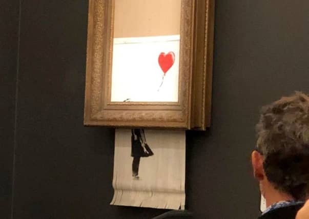 Banksy's artwork, Girl With Balloon shredded itself after being sold for more than £1 million at auction. Picture: PA
