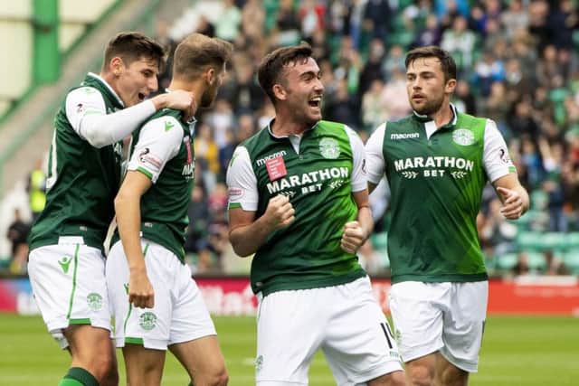 Hibs players celebrate the opening goal. Pic: SNS/Ross Parker