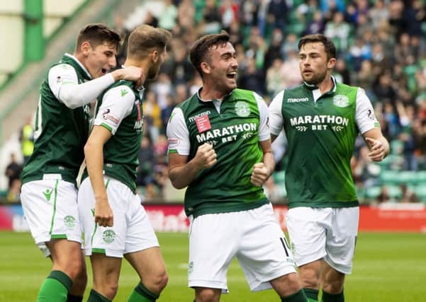 Hibs players celebrate the opening goal. Pic: SNS/Ross Parker