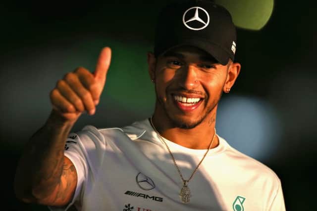 Lewis Hamilton waves to fans during Japanese qualifying. Pic: Charles Coates/Getty Images