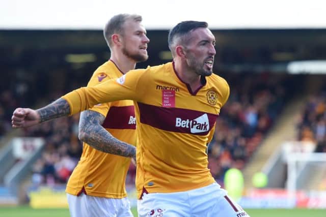 Motherwell's Ryan Bowman (left) and Richard Tait celebrate Motherwell's goal. Pic: SNS/Craig Foy