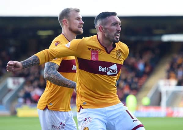 Motherwell's Ryan Bowman (left) and Richard Tait celebrate Motherwell's goal. Pic: SNS/Craig Foy