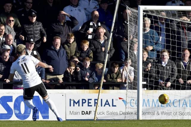 Ayr Uniteds Declan McDaid scores to make it 2-0. Pic: SNS/Rob Casey