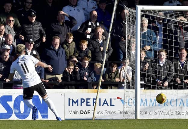 Ayr Uniteds Declan McDaid scores to make it 2-0. Pic: SNS/Rob Casey
