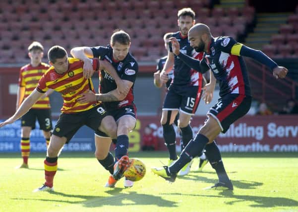 Partick Thistles Kris Doolan faces Ross County defenders. Pic: SNS/Bill Murray