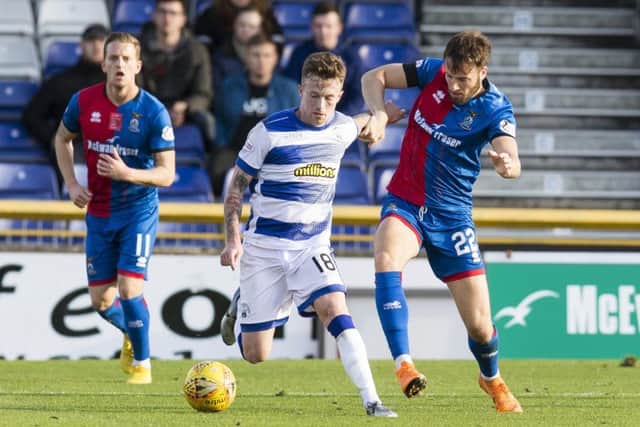 Morton's Gary Oliver holds off Inverness' Brad McKay. Pic: SNS/Bruce White