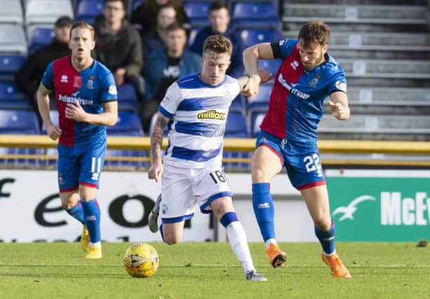Morton's Gary Oliver holds off Inverness' Brad McKay. Pic: SNS/Bruce White