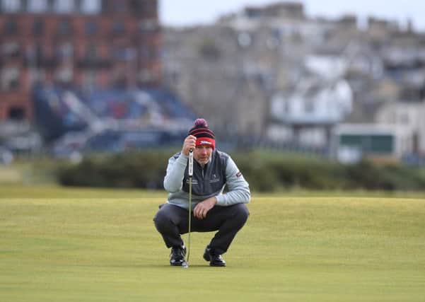 Stephen Gallacher lines up a putt during his final round. Picture: SNS