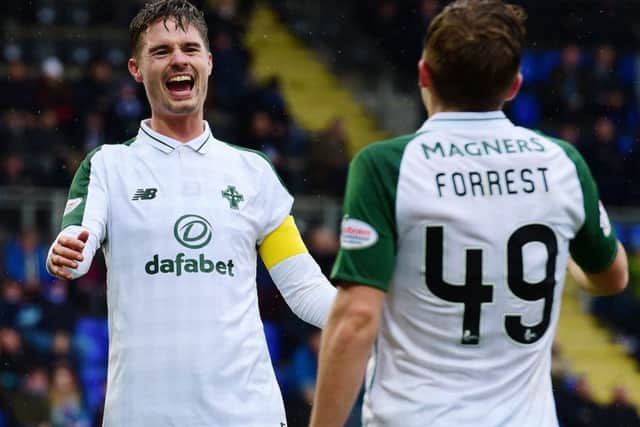 Mikael Lustig congratulates Forrest on his fourth goal. Picture: SNS Group