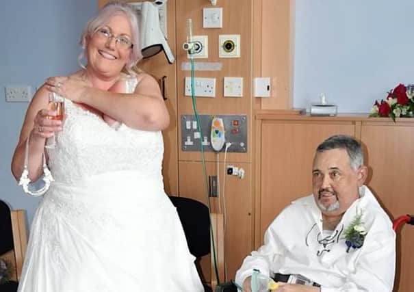 Robert Couttie, 50, and his partner Debbie Coulson. Picture: SWNS