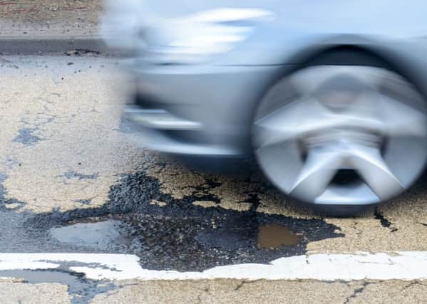 Potholes are a 'great leveller'. Picture: TSPL