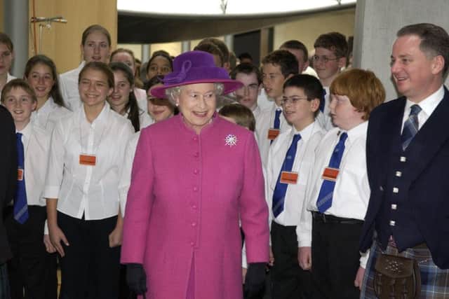 The Queen at Holyrood with First Minister Jack McConnell and members of the National Youth Choir of Scotland at the offical opening on October 9, 2004. PIC: Phil Wilkinson/TSPL.