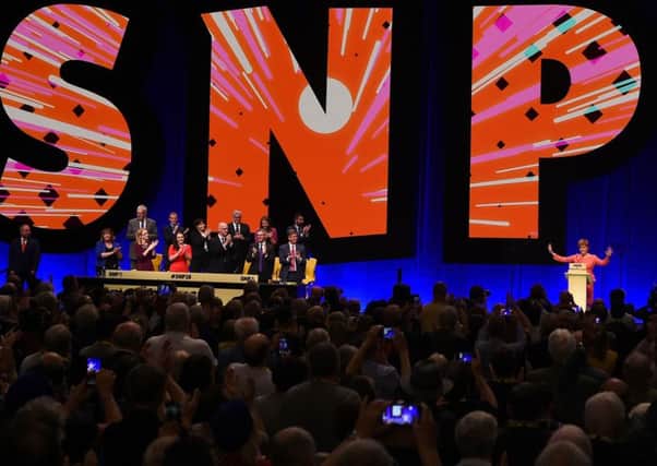 Scotland's First Minister and leader of the Scottish National Party (SNP), Nicola Sturgeon (R) acknowledges the applause as she delivers her keynote speech. Picture: Getty Images