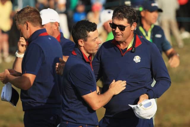Europe's Rory McIlroy with vice-captain Padraig Harrington at last month's Ryder Cup at Le Golf National near Paris. Picture: Mike Ehrmann/Getty Images