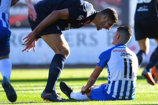 Dundee defender Ryan Inniss (left) shouts at Kilmarnock's Jordan Jones after the award of the penalty. Picture: SNS