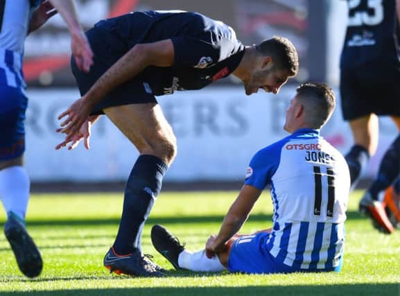 Dundee defender Ryan Inniss (left) shouts at Kilmarnock's Jordan Jones after the award of the penalty. Picture: SNS