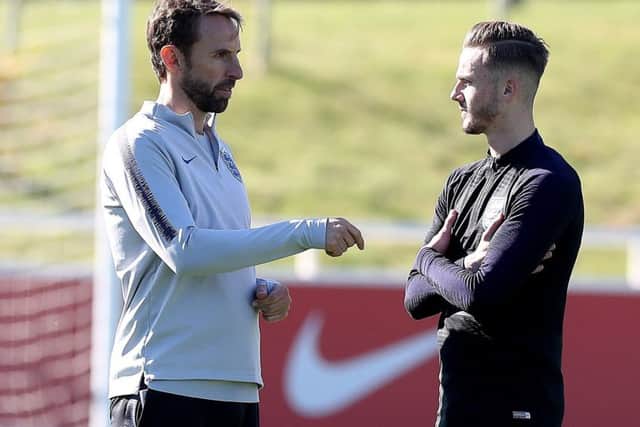 England manager Gareth Southgate, left, with James Maddison. Picture: Martin Rickett/PA Wire