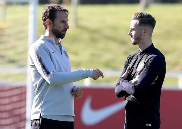 England manager Gareth Southgate, left, with James Maddison. Picture: Martin Rickett/PA Wire