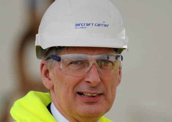 Hard hats advised: Chancellor Philip Hammond must act to prevent a dangerous slide into recession (Picture: Jane Barlow)