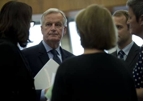 EU chief Brexit negotiator Michel Barnier, second left, talks to other European Commissioners before a weekly meeting at the European Commission headquarters in Brussels. Picture: AP