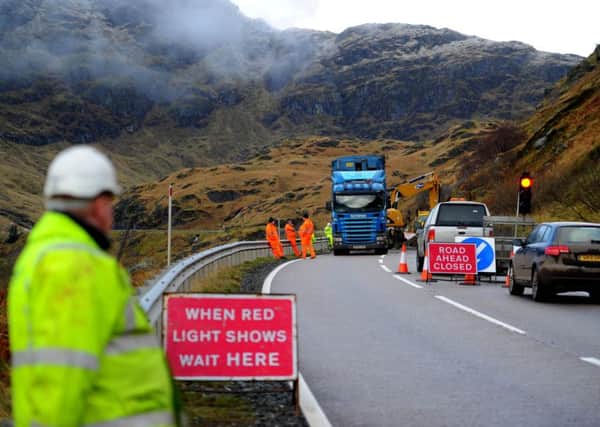 Landslide at the Rest and be Thankful. Workers clear the mud from the A83. Picture: TSPL