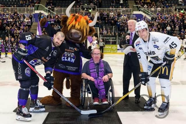 Jamie Wilson, centre, has been described as the "biggest fan" of the Glasgow Clan ice hockey team. Picture: Contributed