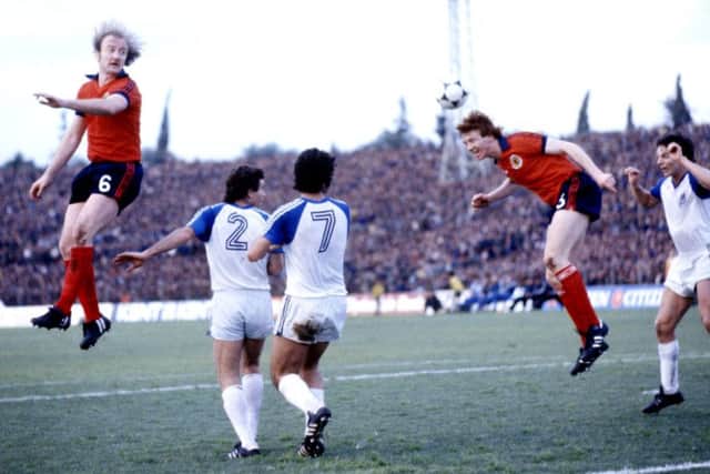 Kenny Burns (left) and Alex McLeish (2nd right) jump for a high ball in the Feburary 1981 clash in Tel Aviv. Picture: SNS Group