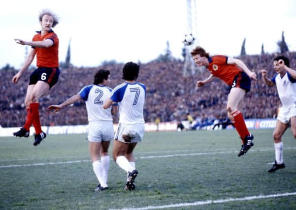 Kenny Burns (left) and Alex McLeish (2nd right) jump for a high ball in the Feburary 1981 clash in Tel Aviv. Picture: SNS Group