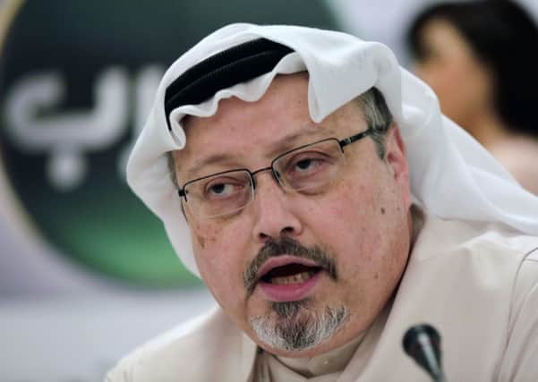 FILE - In this Feb. 1, 2015, file photo, Saudi journalist Jamal Khashoggi speaks during a press conference in Manama, Bahrain. Turkish claims that Khashoggi, who wrote for The Washington Post, was slain inside a Saudi diplomatic mission in Turkey, has put the Trump administration in a delicate spot with one of its closest Mid-east allies.  (AP Photo/Hasan Jamali, File)