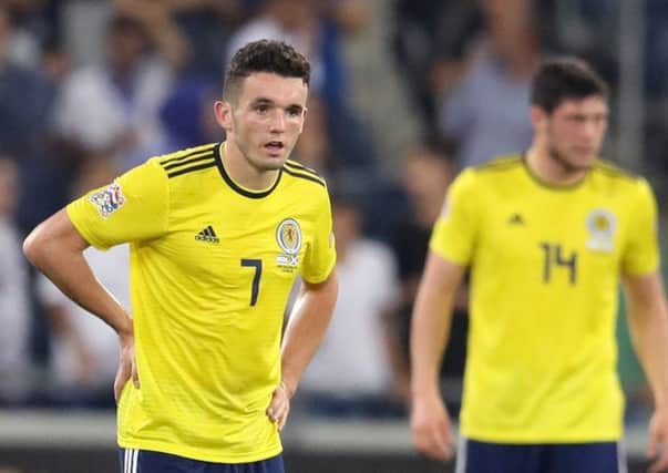 John McGinn is a picture of dejection after Scotland concede the second goal at the Sammy Ofer Stadium. Picture: PA