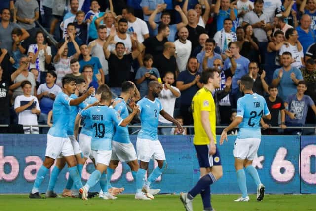 Israel's players celebrate taking the lead against Scotland. Picture: AFP/Getty images