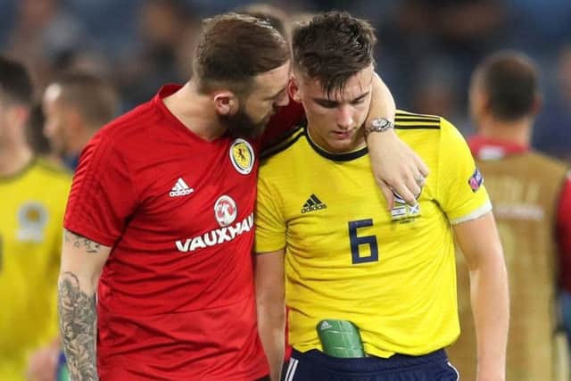 Scotland coach James McFadden consoles Kieran Tierney. Picture: PA