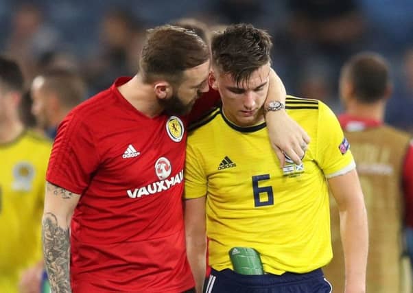 Scotland coach James McFadden consoles Kieran Tierney. Picture: PA
