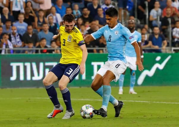 Scotland's Andrew Robertson battles with Israel midfielder Dor Peretz. Picture: AFP