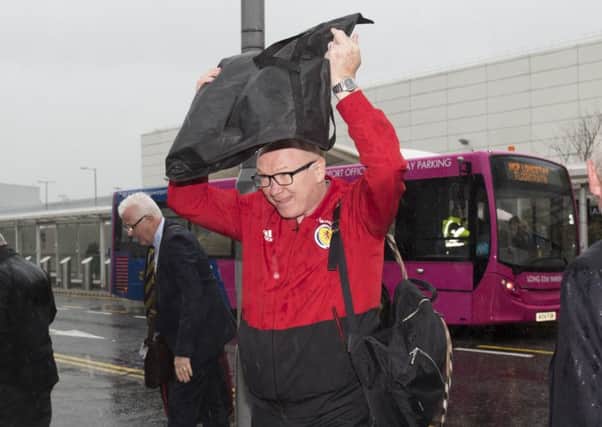 Scotland manager Alex McLeish came home to a wet Glasgow following the defeat in Israel. Picture: Craig Foy/SNS