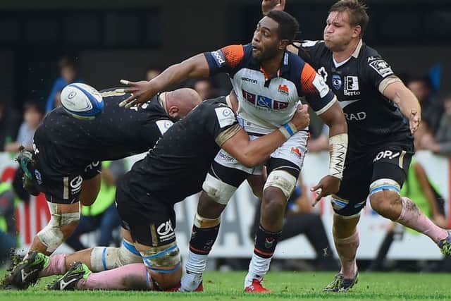 Edinburgh's Bill Mata offloads during the European Champions Cup match in Montpellier. Picture: Sylvain Thomas/AFP/Getty Images