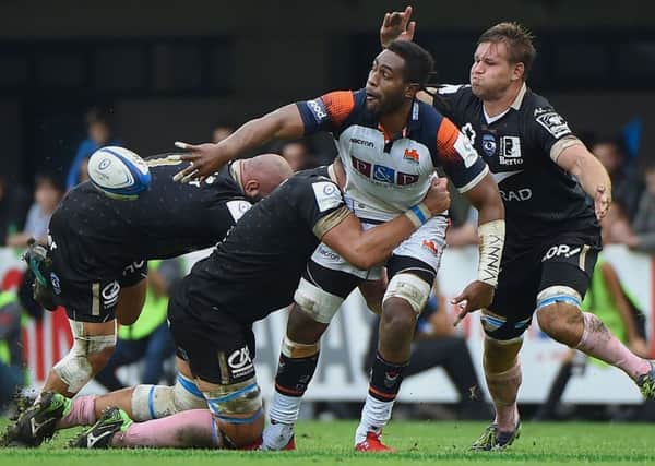 Edinburgh's Bill Mata offloads during the European Champions Cup match in Montpellier. Picture: Sylvain Thomas/AFP/Getty Images